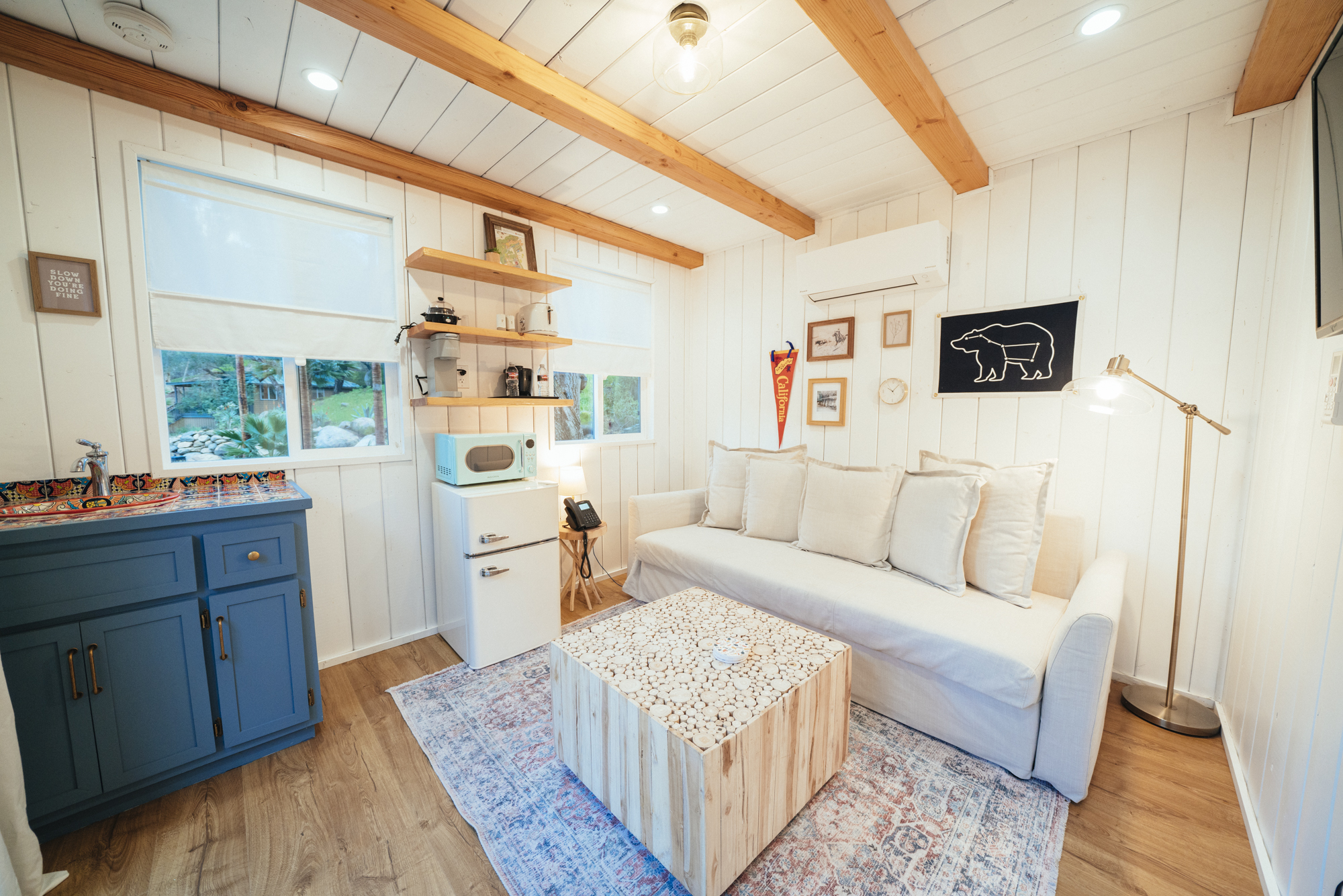 Well lit cabin living room. freshly renovated.