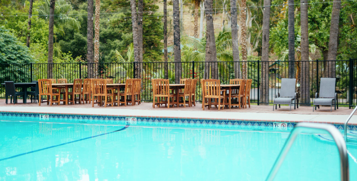View of chair and tbales surrounding the pool area in Bandy Canyon Ranch